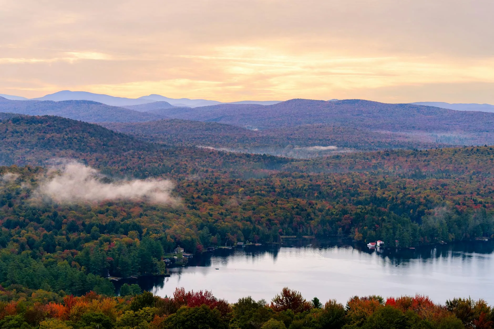 View from a fire tower over forested mountains