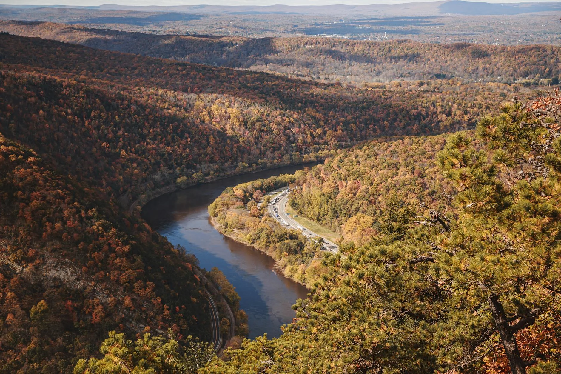 Autumn foliage along a river gorge trail
