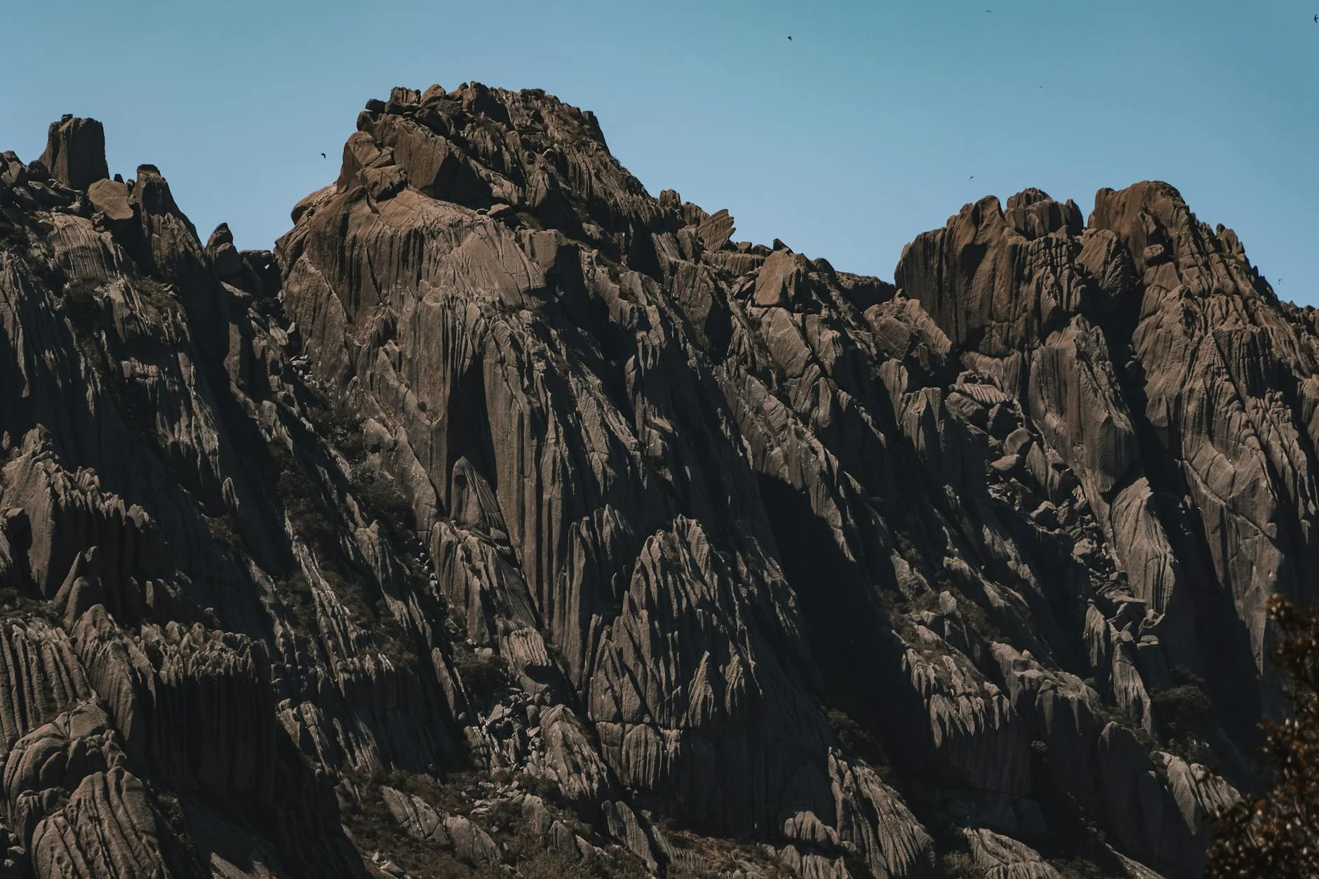 Rocky cliff formation overlooking forested valley
